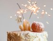 cake with lit sparkling stick