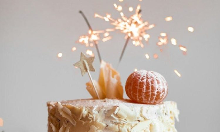 cake with lit sparkling stick