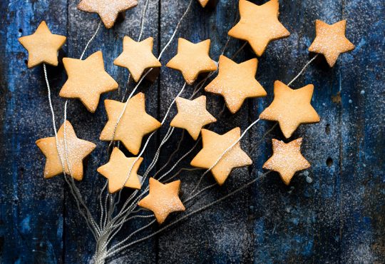 A bunch of star-shaped cookies sitting on top of a table