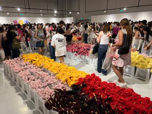 Crowds browsing plush flowers at CJ Hendry's Flower Market installation in Singapore